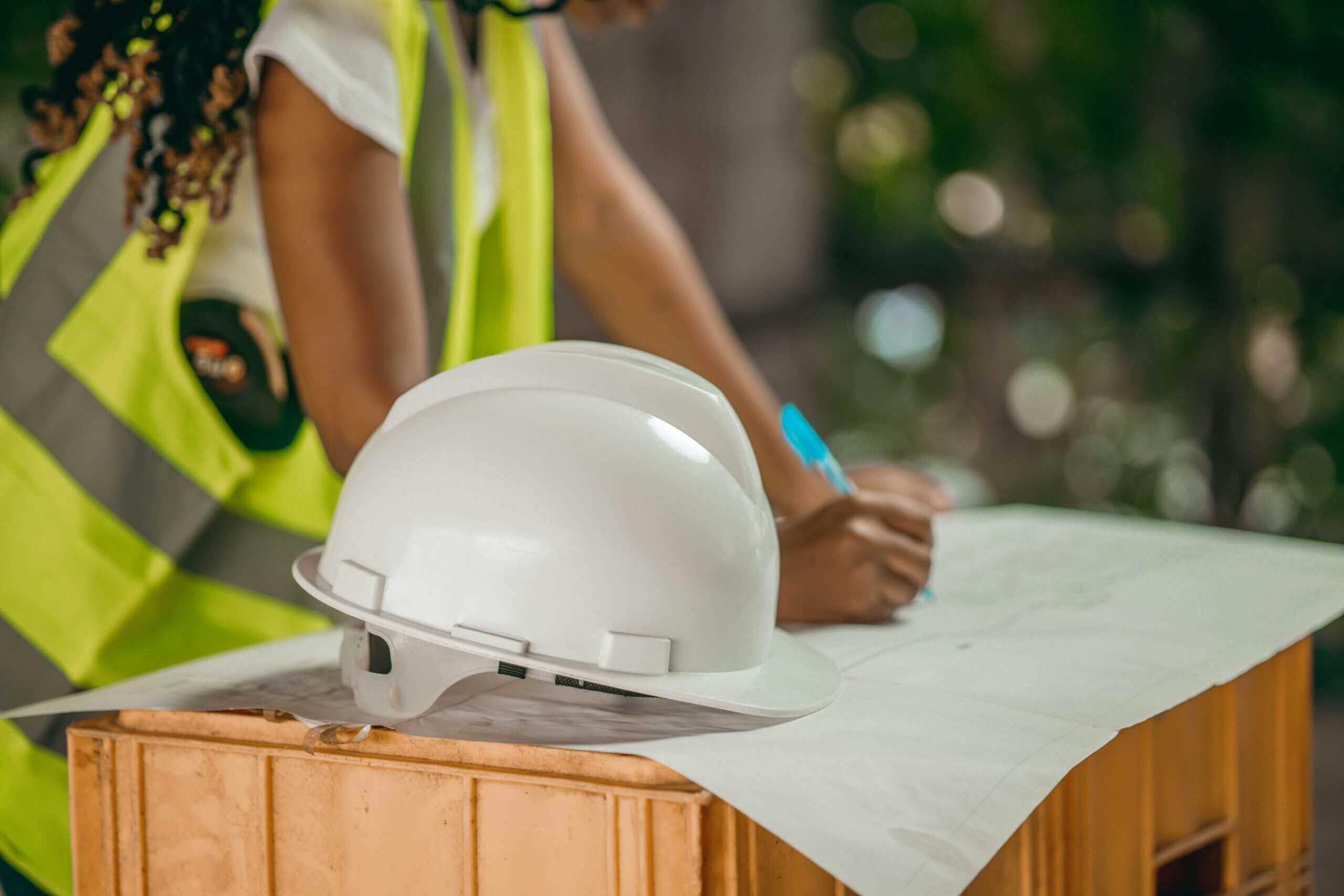 Construction worker planning with helmet